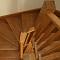 Oak winding staircase with under stairs storage cupboard and step lighting (view3)